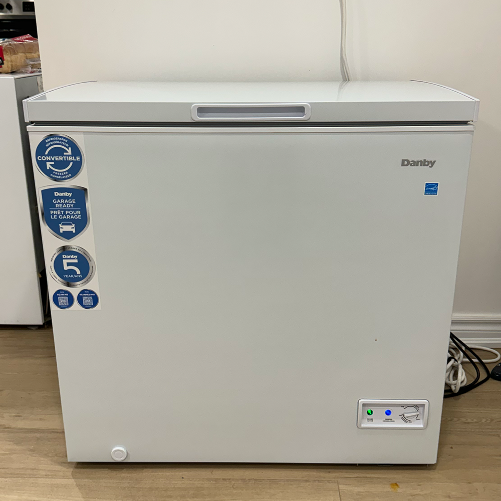 Front facing image of the deep freezer my roommates and I share in our basement apartment.