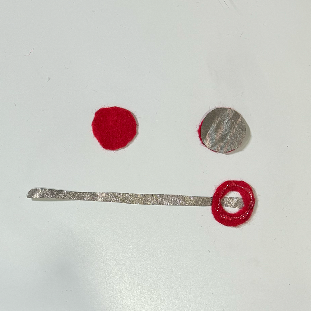 This is an image of all the parts for my final button that was used in the final design. It was inspired by my earlier prototype but with a circle to fit visual needs.