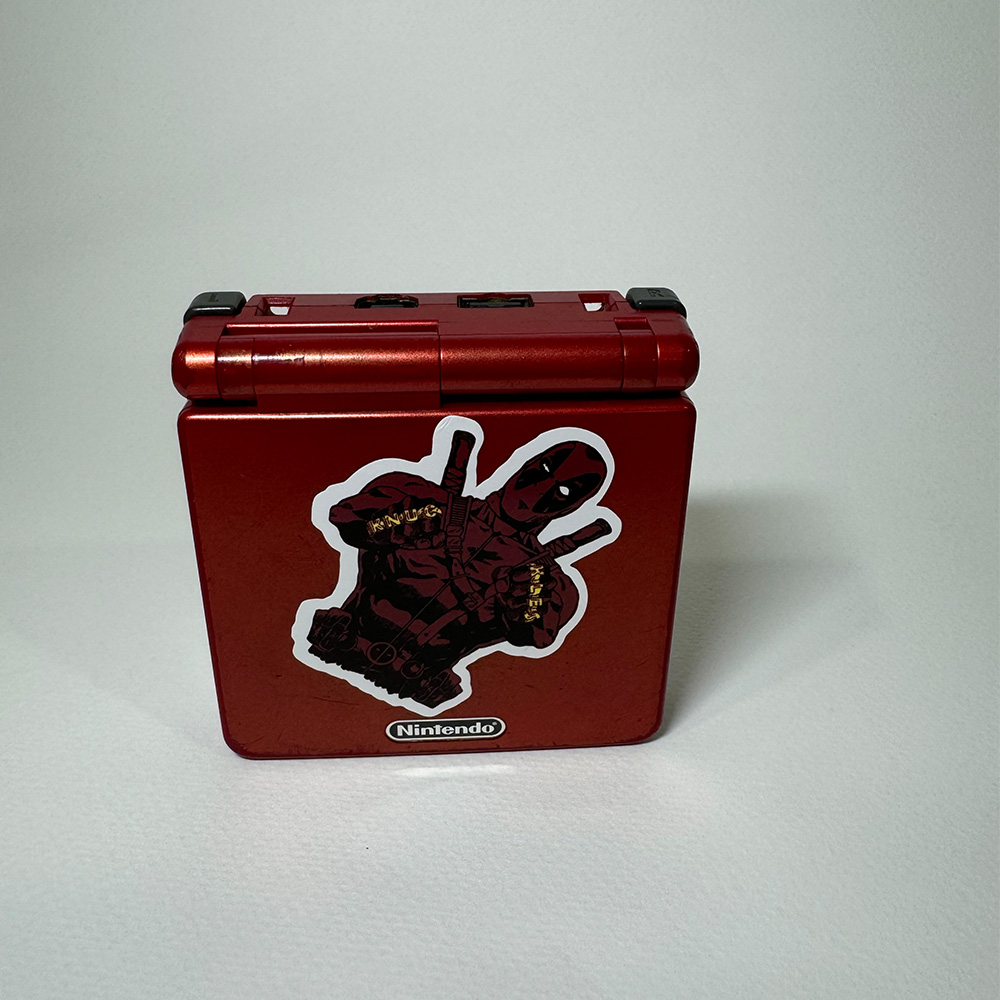 This is a front view of the Gameboy shell with some visability of the buttons and plug in ports.