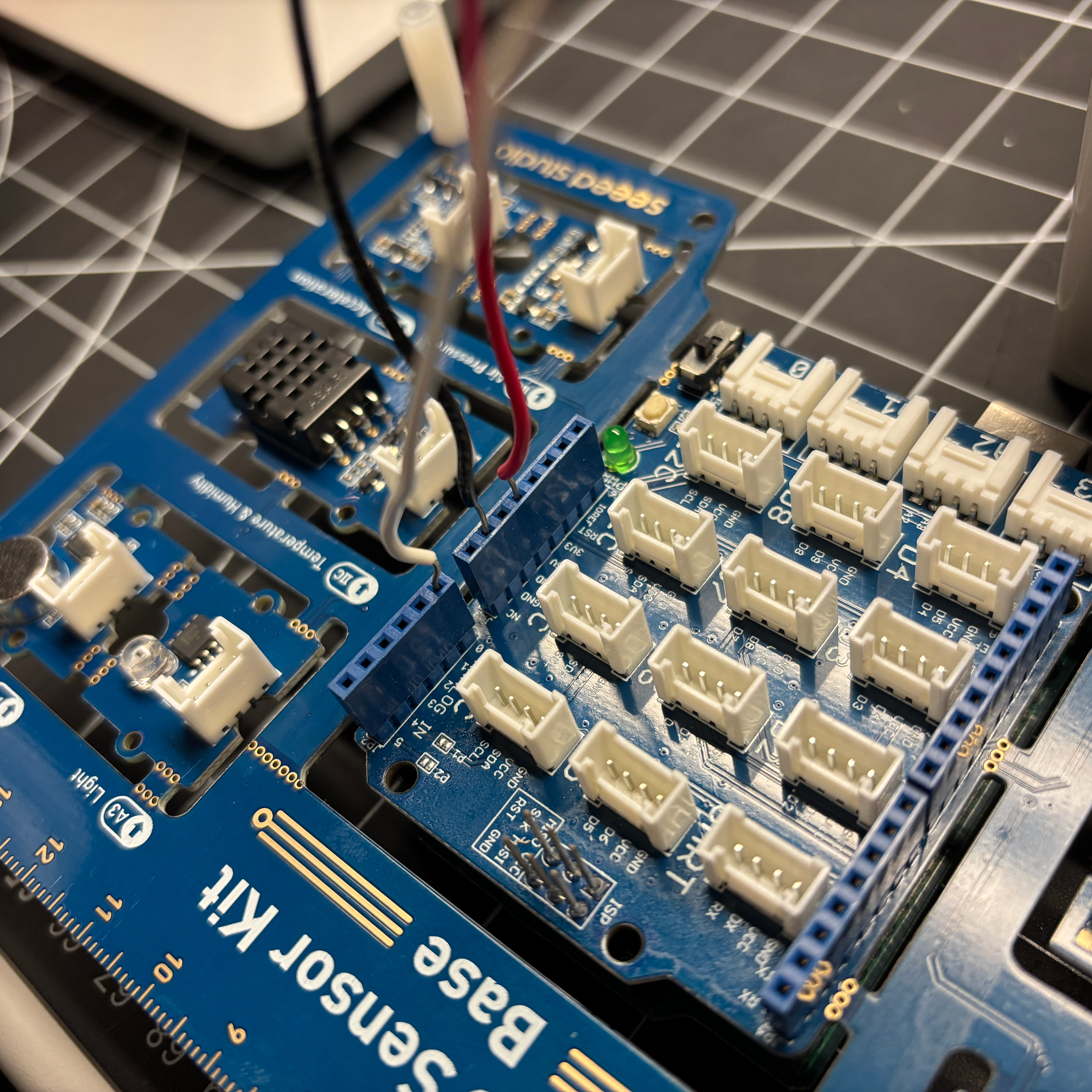 Many sketches that we explored for measuring heart rate using the pulse sensor utilized similar wiring. They would put the white wire (signal) into pin 0, the - black wire into ground, and the + red wire 3 volt (power) pin to activate the sensor. 
